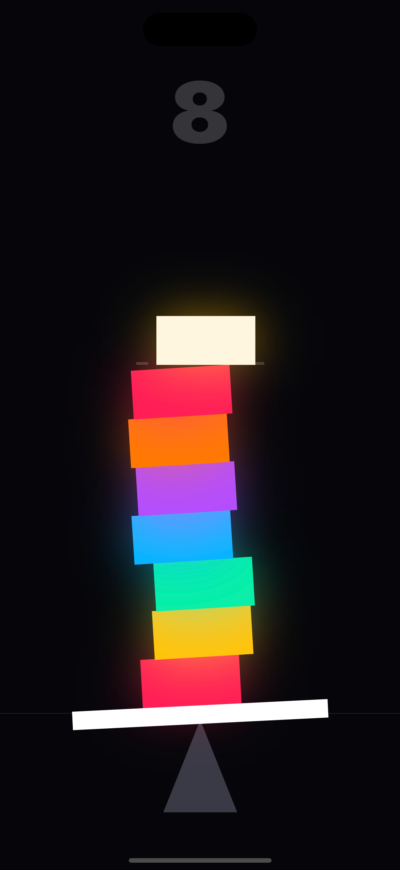 Teeter — a tall leaning tower of coloured blocks balanced on a see-saw